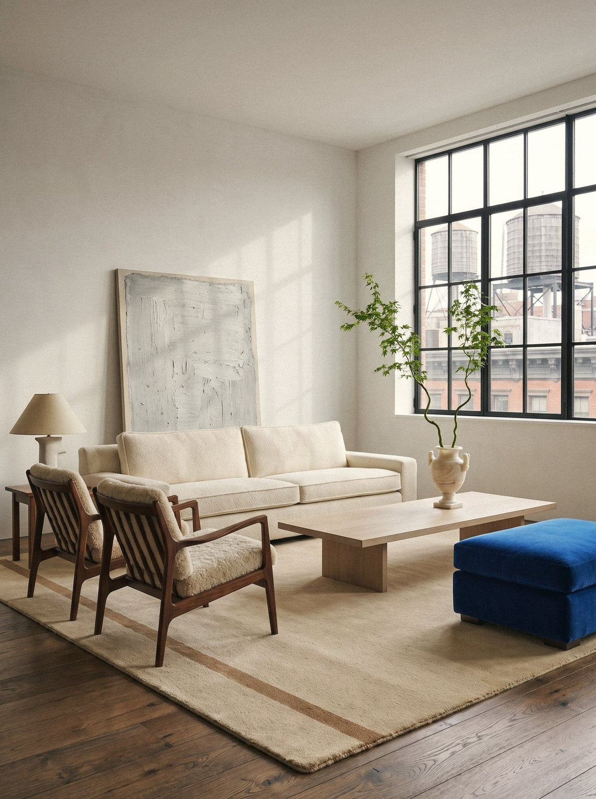 Article 222 sand banded border merino wool hand-loomed rug in a loft living room