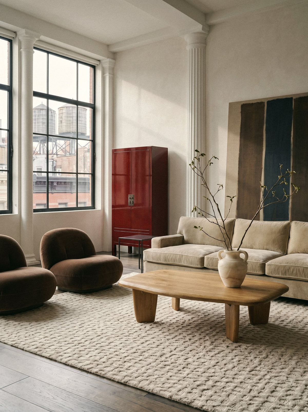 Article 442 ivory pebble alpaca hand-knotted rug in a loft living room