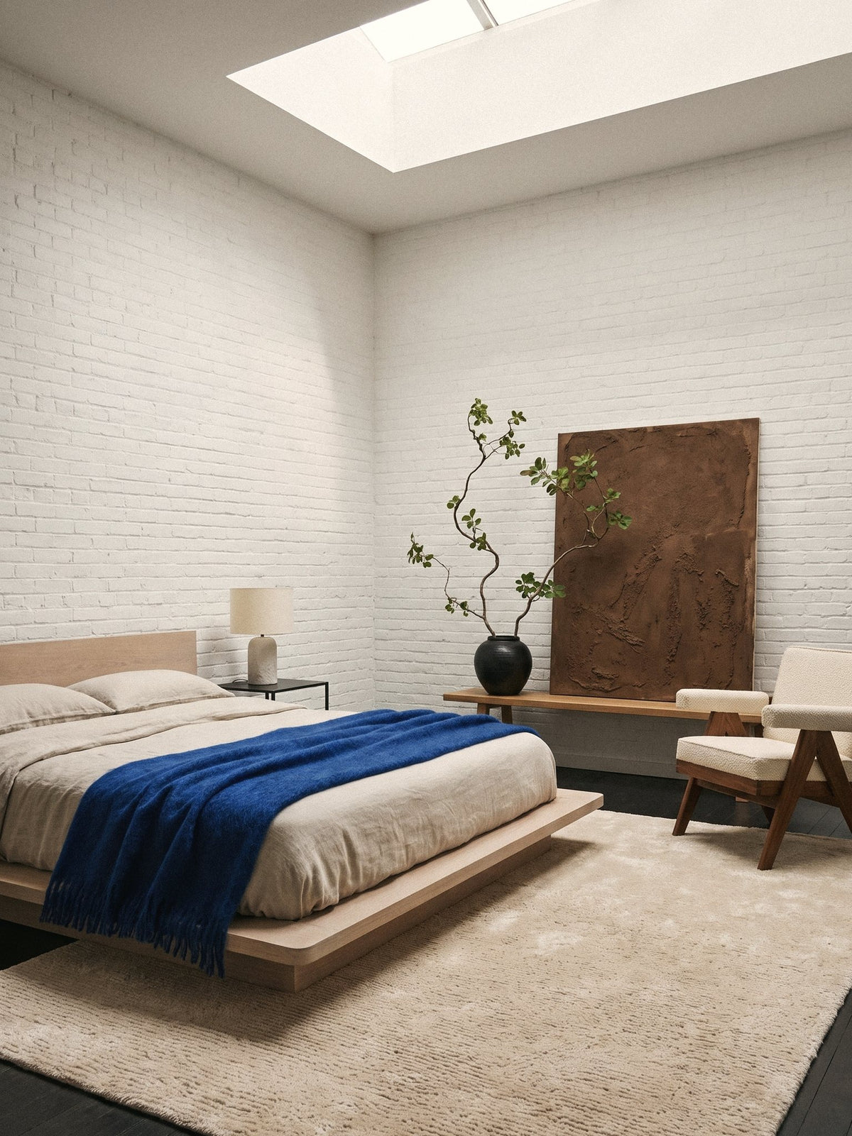 Article 611 ivory solid cashmere handwoven rug in a loft bedroom