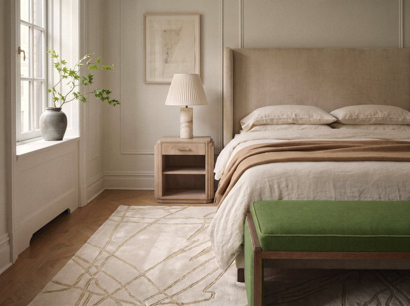 Article 443 ivory abstract line alpaca and linen hand-knotted rug in a bedroom, wide view