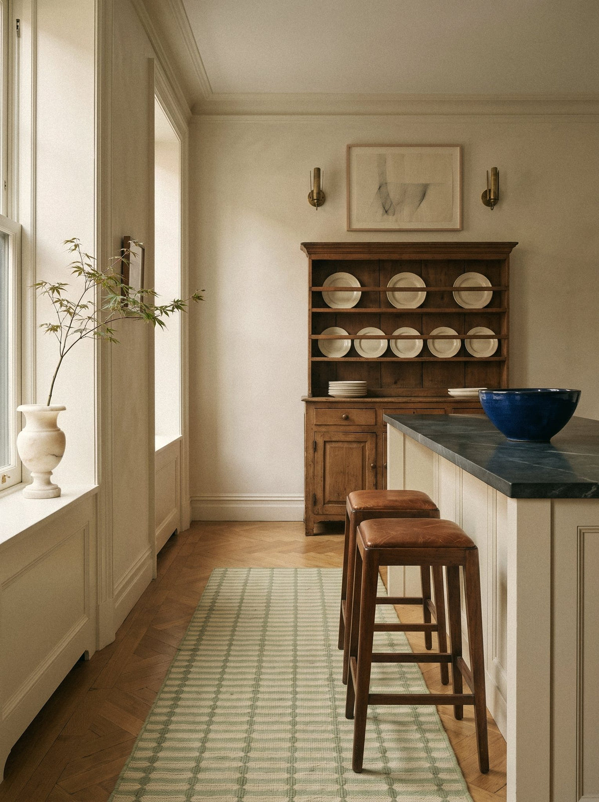 Article 211 sage trellis stripe merino wool flatweave rug as a runner in a kitchen