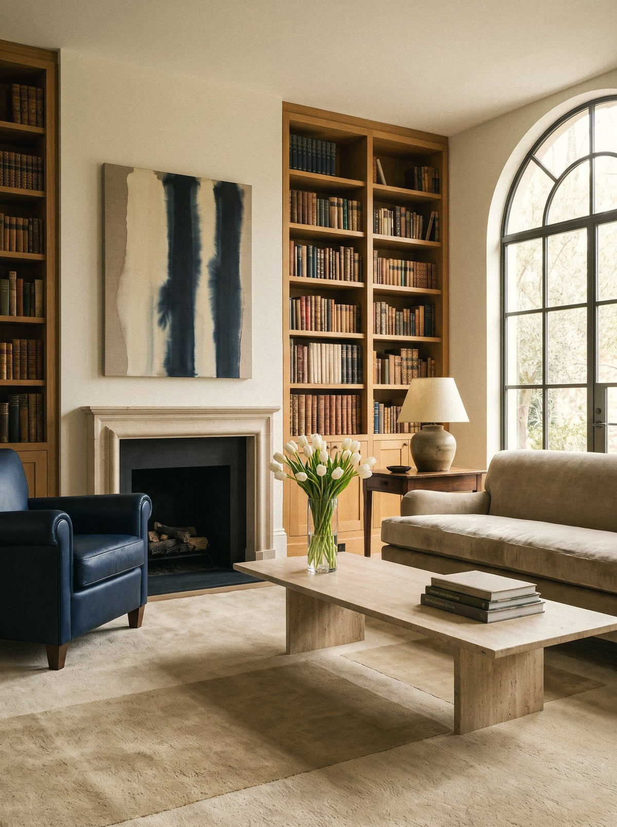 Article 242 camel color block merino wool hand-knotted rug in a library with a fireplace